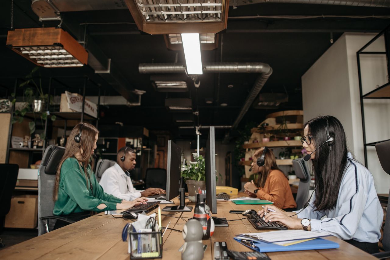 A modern customer service team supported by AI workforce systems